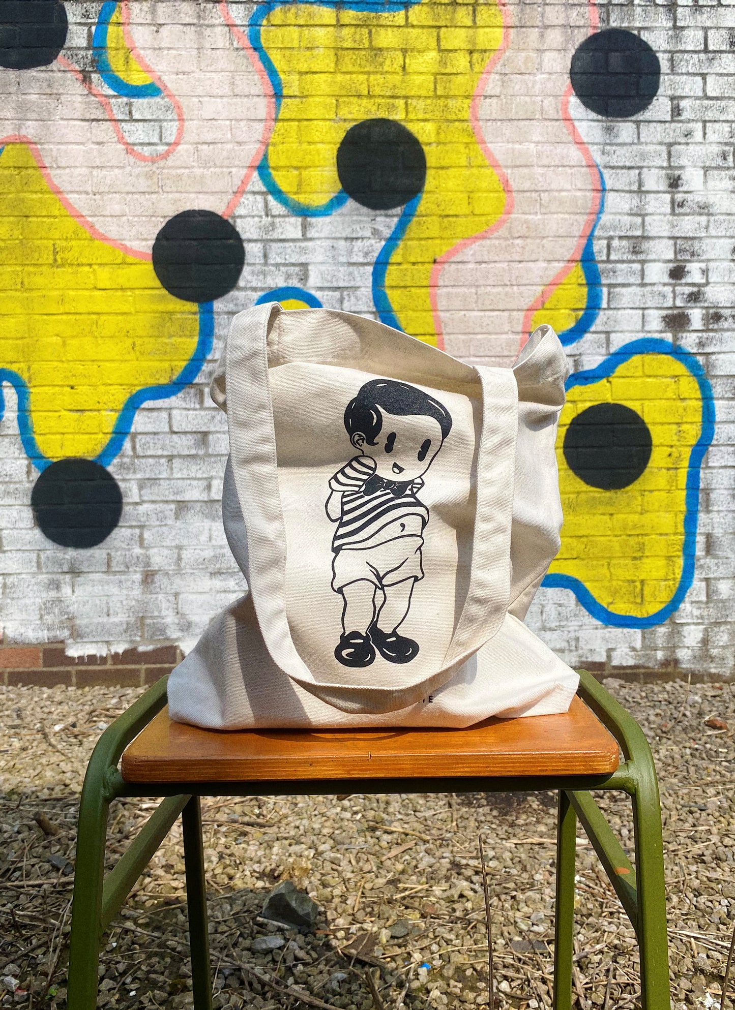 Tote bag sitting on a stool.